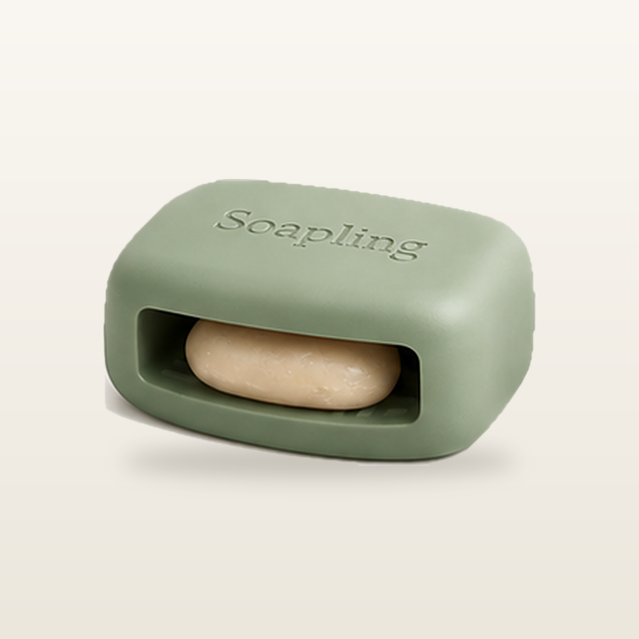 The Soapling bar in Sage Medium with a soap sliver tucked into its side pocket