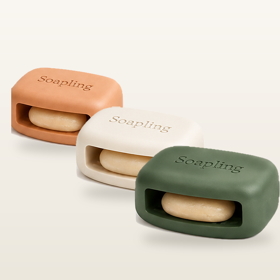 Three Soapling bars in Terracotta, Cream, and Sage Deep arranged in a row